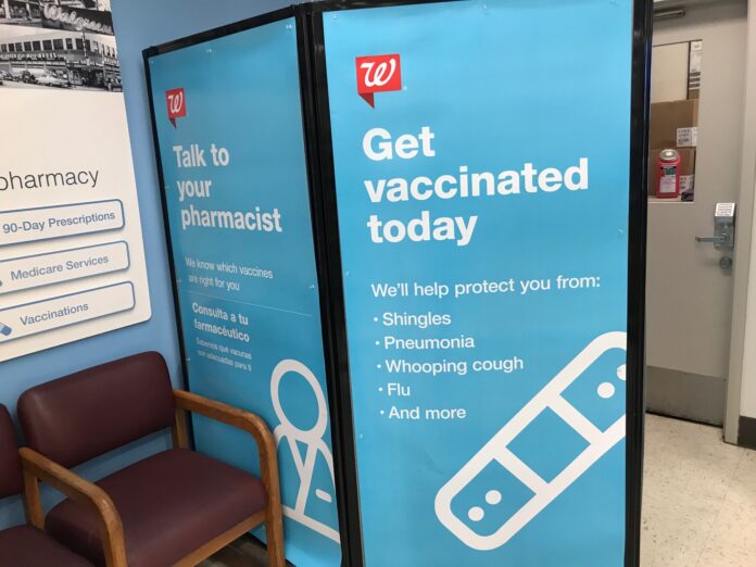 SUPPLIES OF the Shingrix shingles vaccine in the area are low but improving. Above, a vaccination advertisement at the Walgreens located at 12 East Main Rd., Middletown. / PBN PHOTO/JANINE WEISMAN