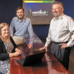 MEETING OF MINDS: Vertikal6 CEO Rick Norberg, right, with applications developer James Green and senior consultant Meredith Carroll. PBN PHOTO/DAVE HANSEN