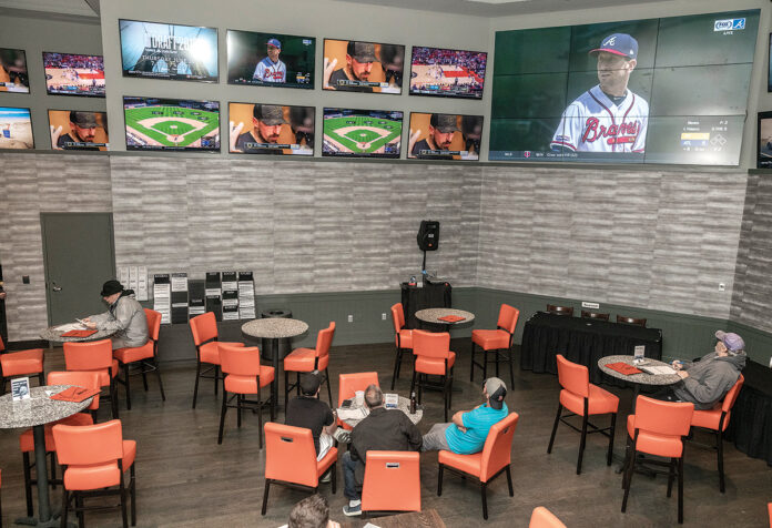 A CASE alleging sports betting in Rhode Island is unconstitutional was dismissed in R.I. Superior Court. Above, guests relax in the lounge at the sportsbook at the Twin River Casino Hotel in Lincoln. / PBN FILE PHOTO/MICHAEL SALERNO