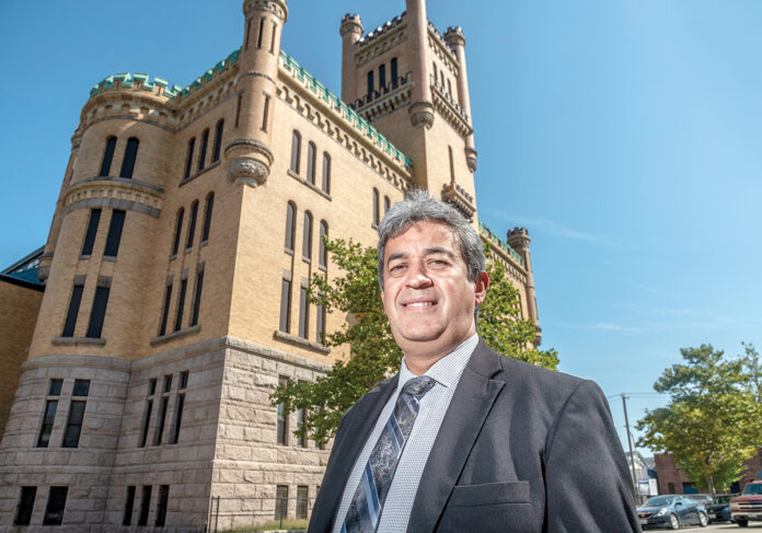 SIGNIFICANT IMPACT: Rhode Island Hispanic Chamber of Commerce CEO and President Oscar Mejias, who is also a member of a steering committee guiding the state in determining how to best put the Cranston Street Armory, above, to use, says its reopening will have a significant impact on the surrounding community.  / PBN PHOTO/MICHAEL SALERNO