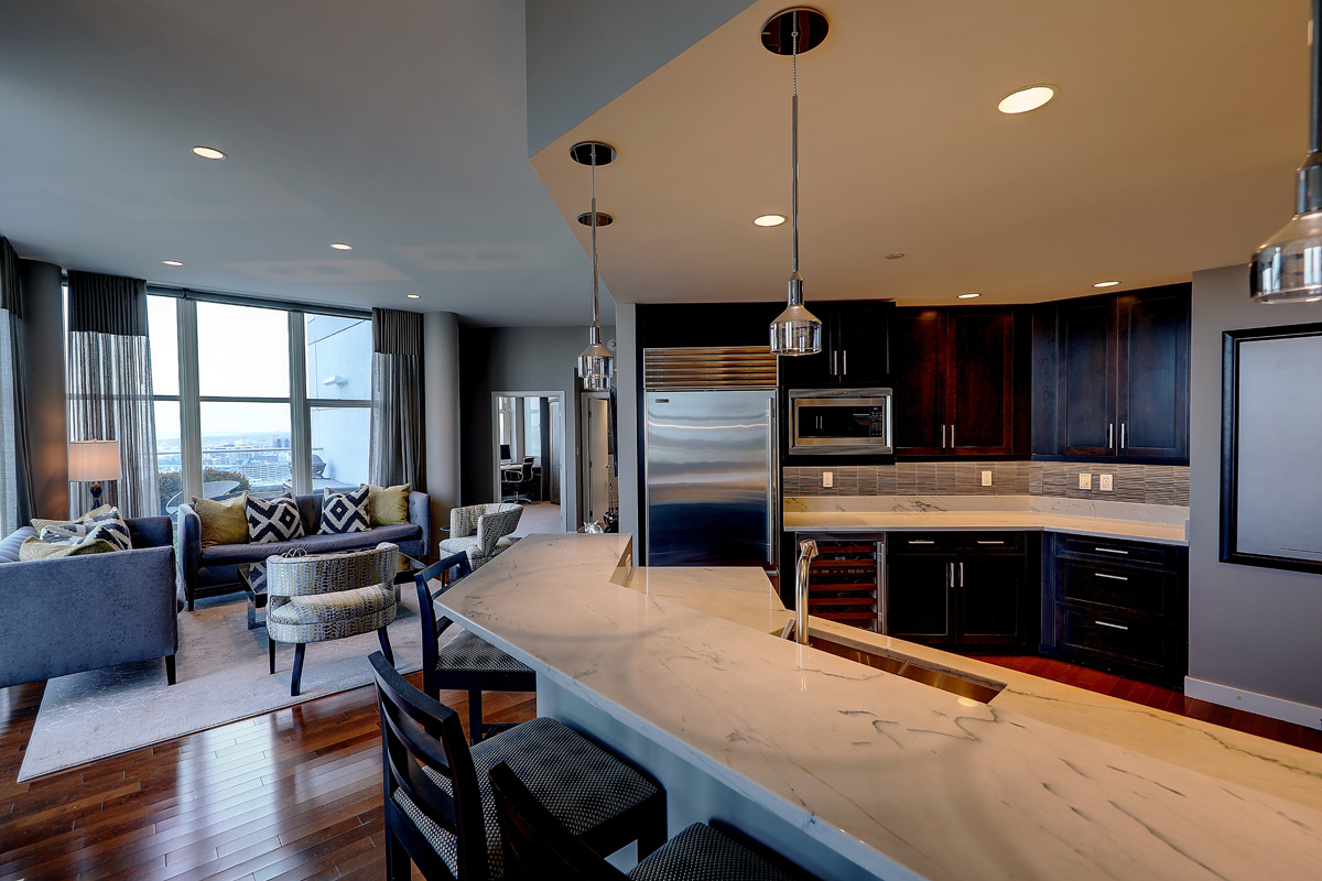 THE CONDO has a chef's kitchen with bar seating. / COURTESY RESIDENTIAL PROPERTIES LTD.