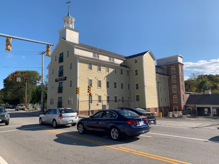 COMMERCE RI approved an increase in Rebuild Rhode Island credits by $450,000 to $2.6 million to Pawtucket Development Group for its project developing residential units at Lippitt Mill in West Warwick, pictured above. / PBN PHOTO/MARY MACDONALD