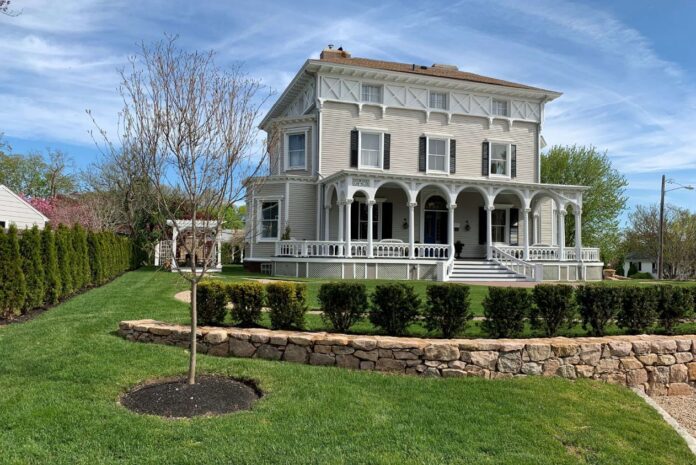 CHERYL HACKETT and John Grosvenor will be honored with the Rhody Awards Historic Homeowner Award for the restoration of the Restmere property in Middletown, pictured above. / COURTESY NEWPORT RESTORATION FOUNDATION