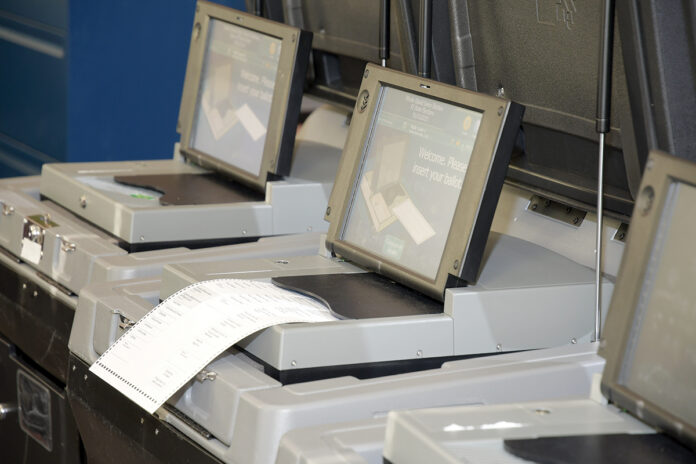 OPENING FOR HACKERS? The R.I. Board of Elections is studying whether modems added to voting machines in 2016 now represent a cybersecurity risk because they transmit encrypted data over the internet. / PBN PHOTO/MIKE SKORSKI