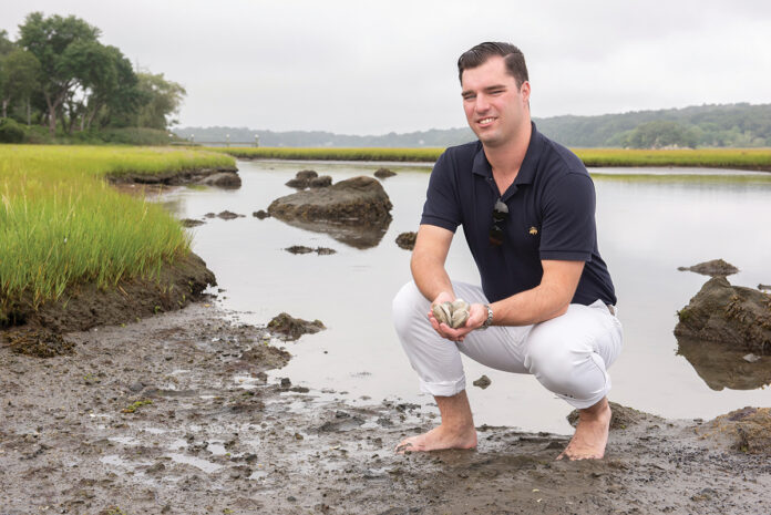 CULTURED WORKPLACE: Brendan Breen has developed a way for quahogs to produce pearls, which he plans to sell overseas or to jewelry makers closer to home.   / PBN PHOTO/DAVE HANSEN