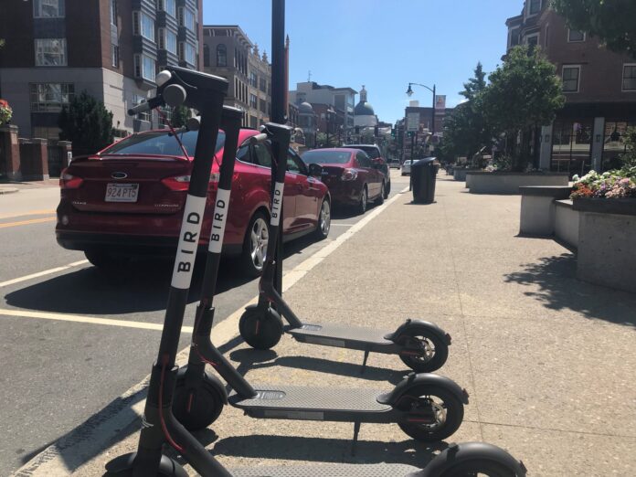 ELECTRIC SCOOTERS, similar to those seen in Providence earlier this year, shown above, have returned to the city through a different operator, Spin Inc. Bird Rides Inc. no longer operates scooters in the city. / PBN FILE PHOTO/CHRIS BERGENHEIM