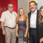 BALANCED GROWTH: From left, Carl Coutu, Jo Anne Samborsky, Joseph Dias and Jennifer Bove, franchise owners of Keller Williams Central Rhode Island in Cranston. Coutu, who purchased the location in 2011 and is stepping down as operating principal, will be succeeded by Bove. / PBN PHOTO/MICHAEL SALERNO