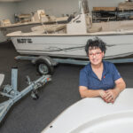 MAKING WAVES: Debbie A. Wood, president and co-owner of Wood Boat & Motor Inc. in Warwick, decided with her husband, Russell, to take over running the Providence Boat Show, which has been rebranded the Rhode Island Boat Show, after the previous organizers stepped down after three decades at the helm. / PBN PHOTO/MICHAEL SALERNO
