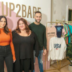 STITCHING SUCCESS: Heather Fortes, center, and her two business partners, Nicole Almeida, and Fortes’ son, Nathan, have moved an online business in specialty clothing and accessories into a retail store in East Providence. / PBN PHOTO/MICHAEL SALERNO