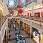 EVOLVING: Shoppers pass through the common areas of the Providence Place mall. The mall features entertainment that goes beyond apparel stores, cineplexes and fast-food chains, such as a kids’ veterinary clinic with stuffed animals, a Thai restaurant and arcade games. / PBN PHOTO/MICHAEL SALERNO