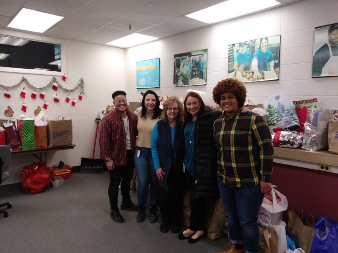 BUSINESS DONATIONS helped boost Meals on Wheels of Rhode Island's Senior Wish Program. From left to right: From left to right: Mason Im, BCBSRI; Christina Castle, BCBSRI; Lauri Kaplan, Meals on Wheels RI; Carolyn Belisle, BCBSRI; Mya Kemp, BCBSRI. /COURTESY BLUEE CROSS & BLUE SHIELD OF RHODE ISLAND