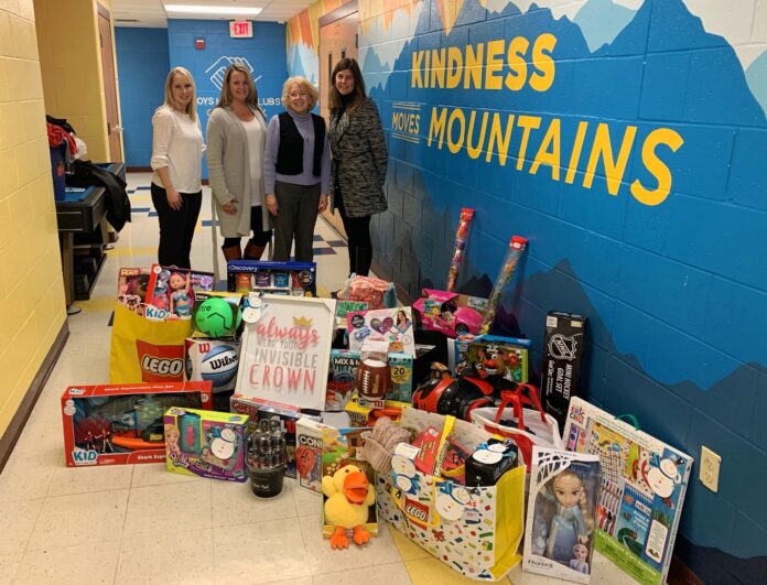 BANK RHODE ISLAND’S annual Holiday Giving Tree program collected 1,466 presents for local children in need this season. Pictured from left: Tiffany Lee, teller supervisor; Jennifer Kilday, Warwick Avenue branch manager, BankRI; Eleanor Acton, development director, Boys & Girls Clubs of Warwick; and Kelly Kavanaugh, West Shore Road branch manager, BankRI. / COURTESY BANK RHODE ISLAND