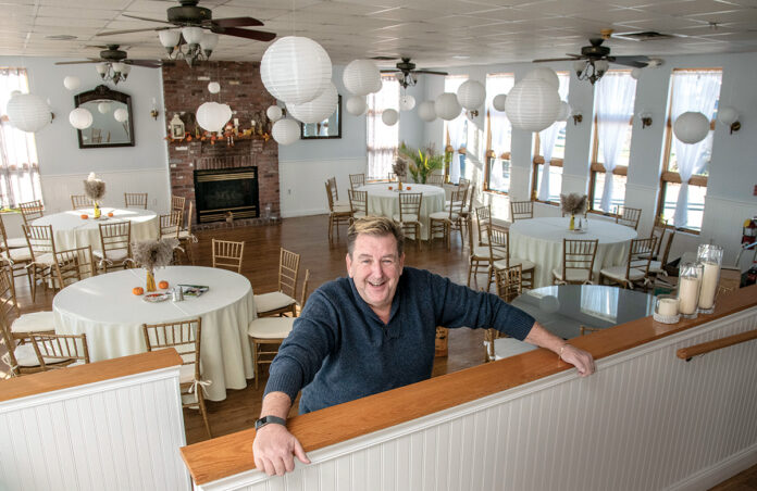 IN ANY EVENT: Mark Brown, co-owner of Cozy Caterers, stands in one of the party spaces available at the Warwick venue where the catering company relocated last May. / PBN PHOTO/MICHAEL SALERNO
